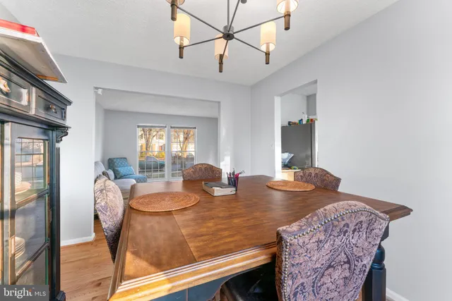 a view of a dining room with furniture and a window