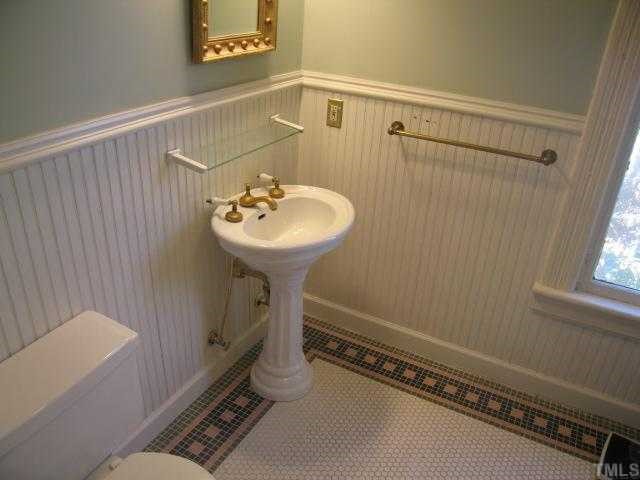 500 Polk Street Raleigh, NC 27604 - Photo 9 of 12 a bathroom with a sink and mirror