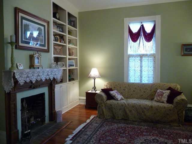 500 Polk Street Raleigh, NC 27604 - Photo 8 of 12 a living room with furniture and a fireplace