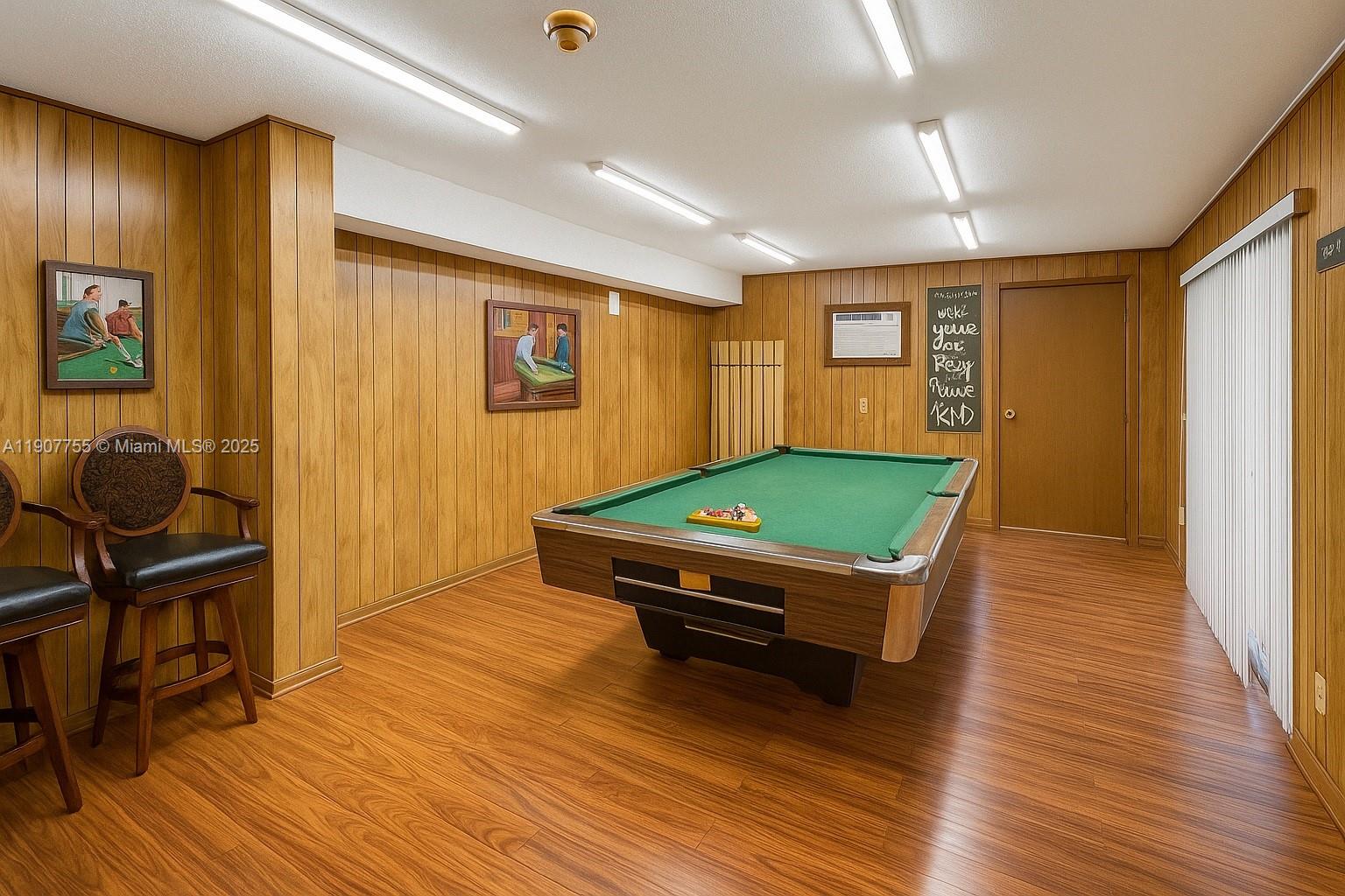 200 172nd Street, Unit 201 Sunny Isles Beach, FL 33160 - Photo 11 of 12 a room with pool table and windows