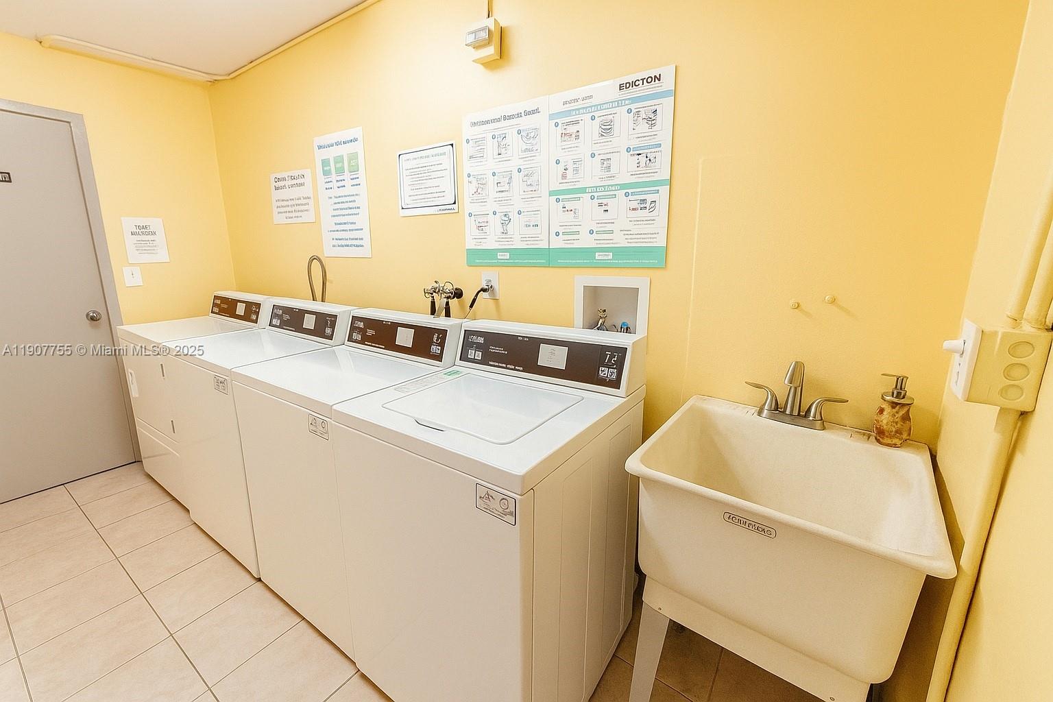 200 172nd Street, Unit 201 Sunny Isles Beach, FL 33160 - Photo 12 of 12 a utility room with dryer and washer
