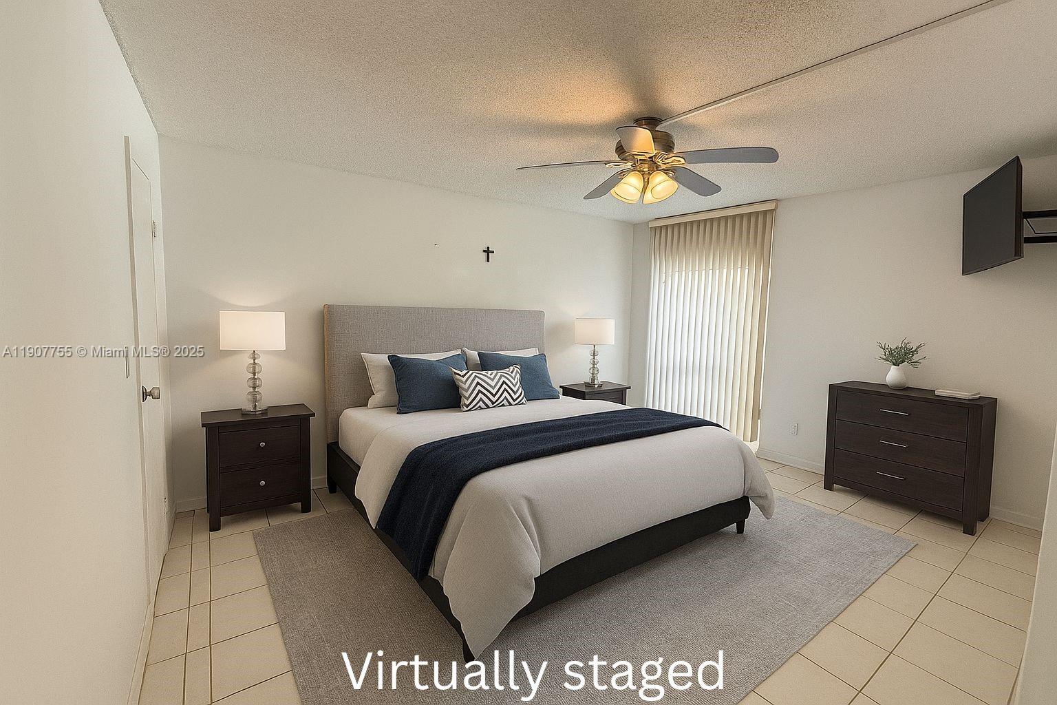 200 172nd Street, Unit 201 Sunny Isles Beach, FL 33160 - Photo 5 of 12 a bedroom with a bed and a chandelier