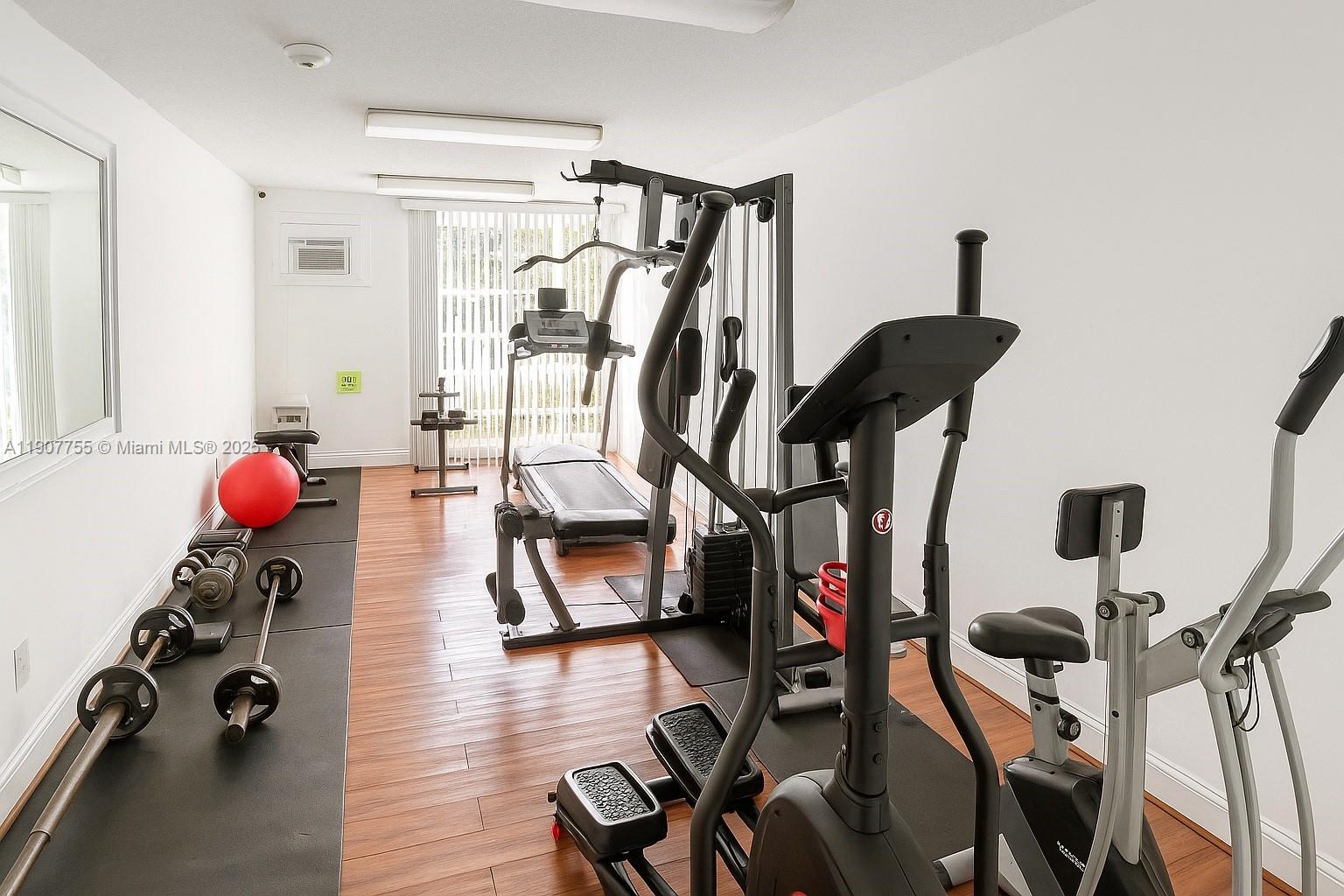 200 172nd Street, Unit 201 Sunny Isles Beach, FL 33160 - Photo 8 of 12 a view of a room with gym equipment