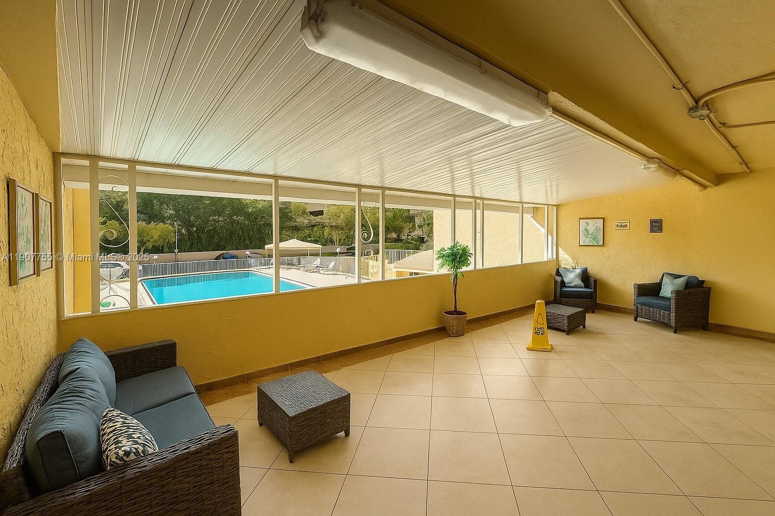 200 172nd Street, Unit 201 Sunny Isles Beach, FL 33160 - Photo 9 of 12 a view of a living room and dining room