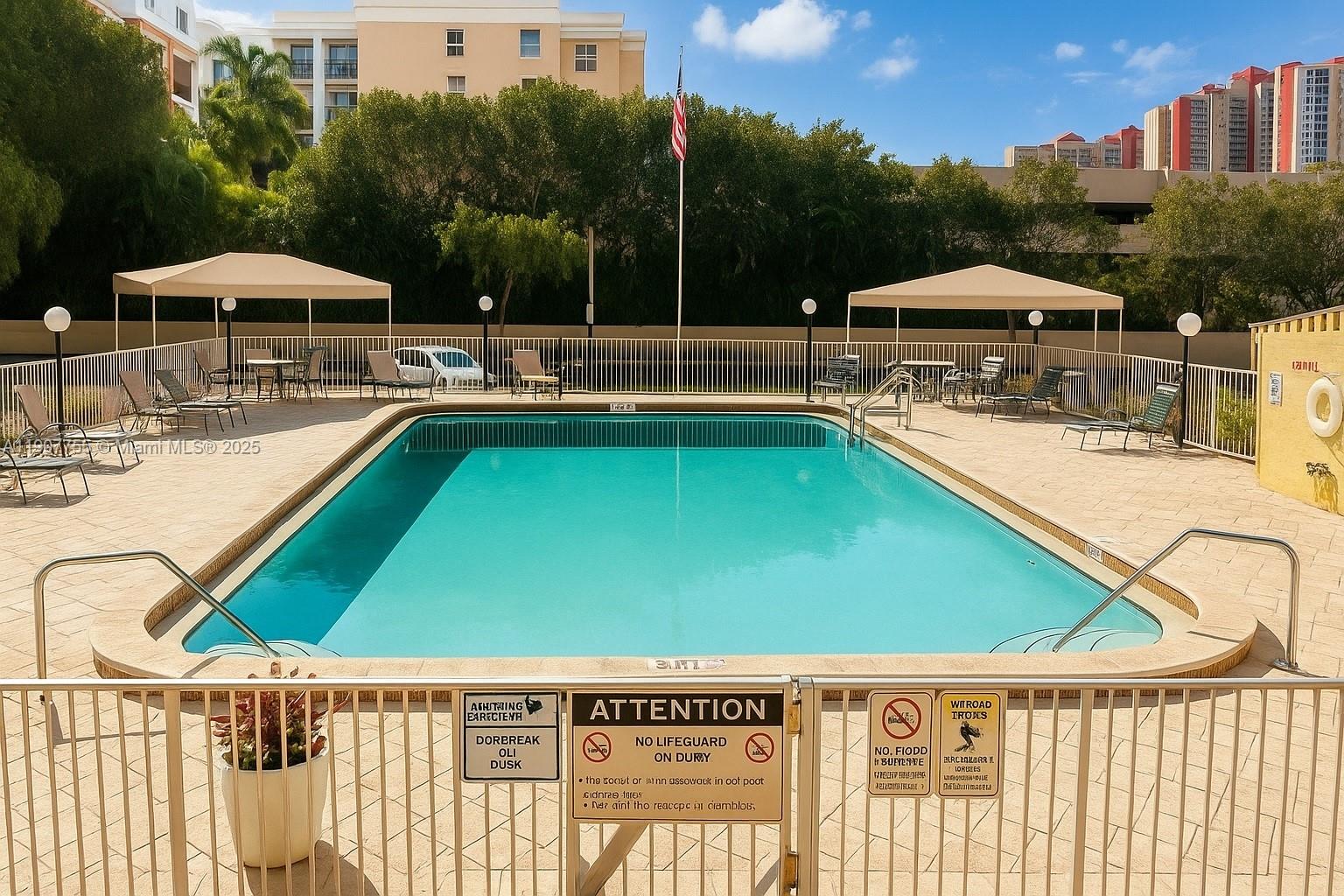 200 172nd Street, Unit 201 Sunny Isles Beach, FL 33160 - Photo 10 of 12 a view of swimming pool with seating area