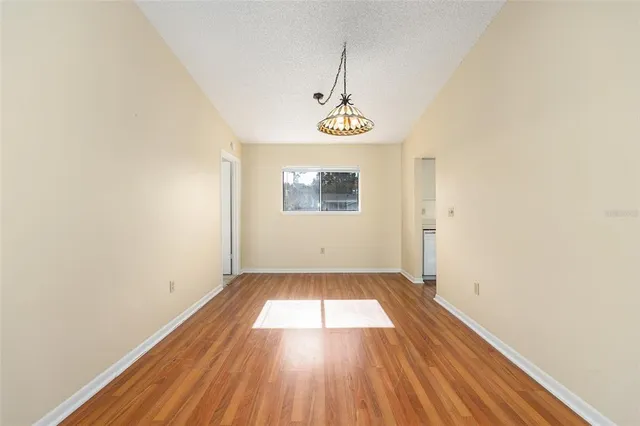 a view of a house with a yard and tree s