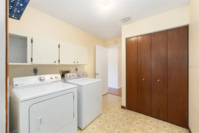 a view of a kitchen with wooden floor and a kitchen space