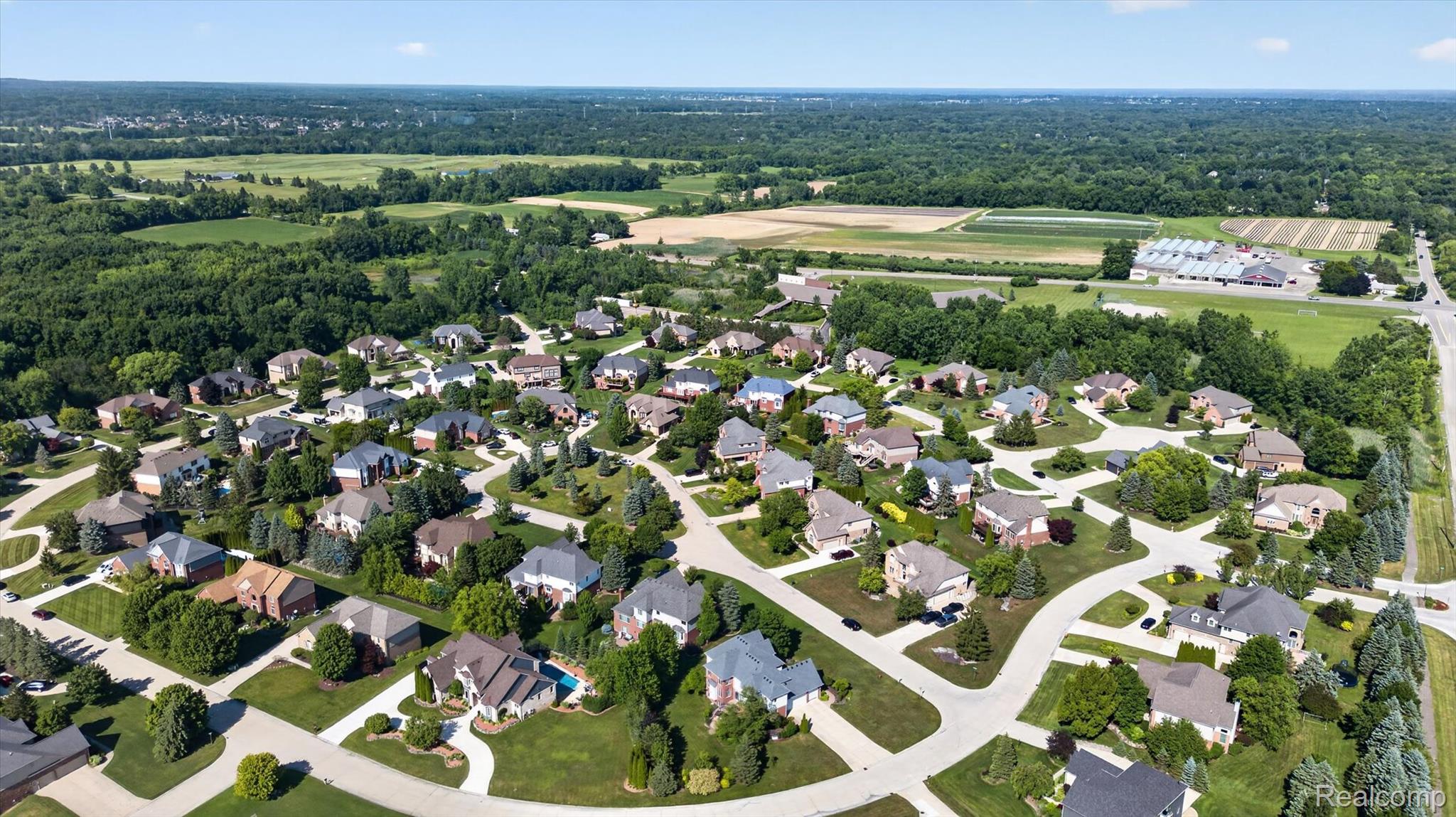 3804 Elk Drive Rochester, MI 48306 - Photo 73 of 75 Aerial perspective showcasing a residential community with winding streets, mature landscaping, and varied architectural styles