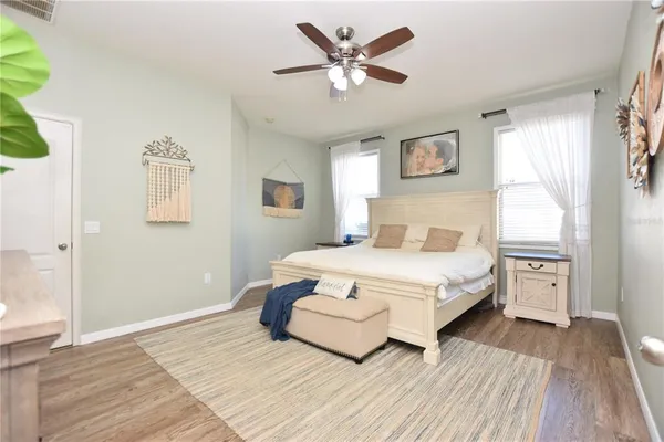 a bedroom with a large bed and a window