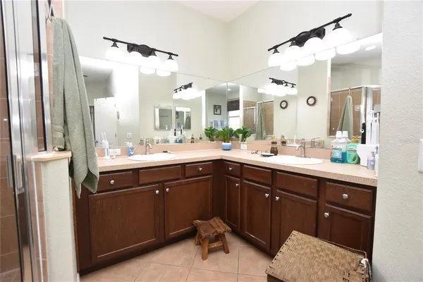 a bathroom with a sink vanity and a mirror