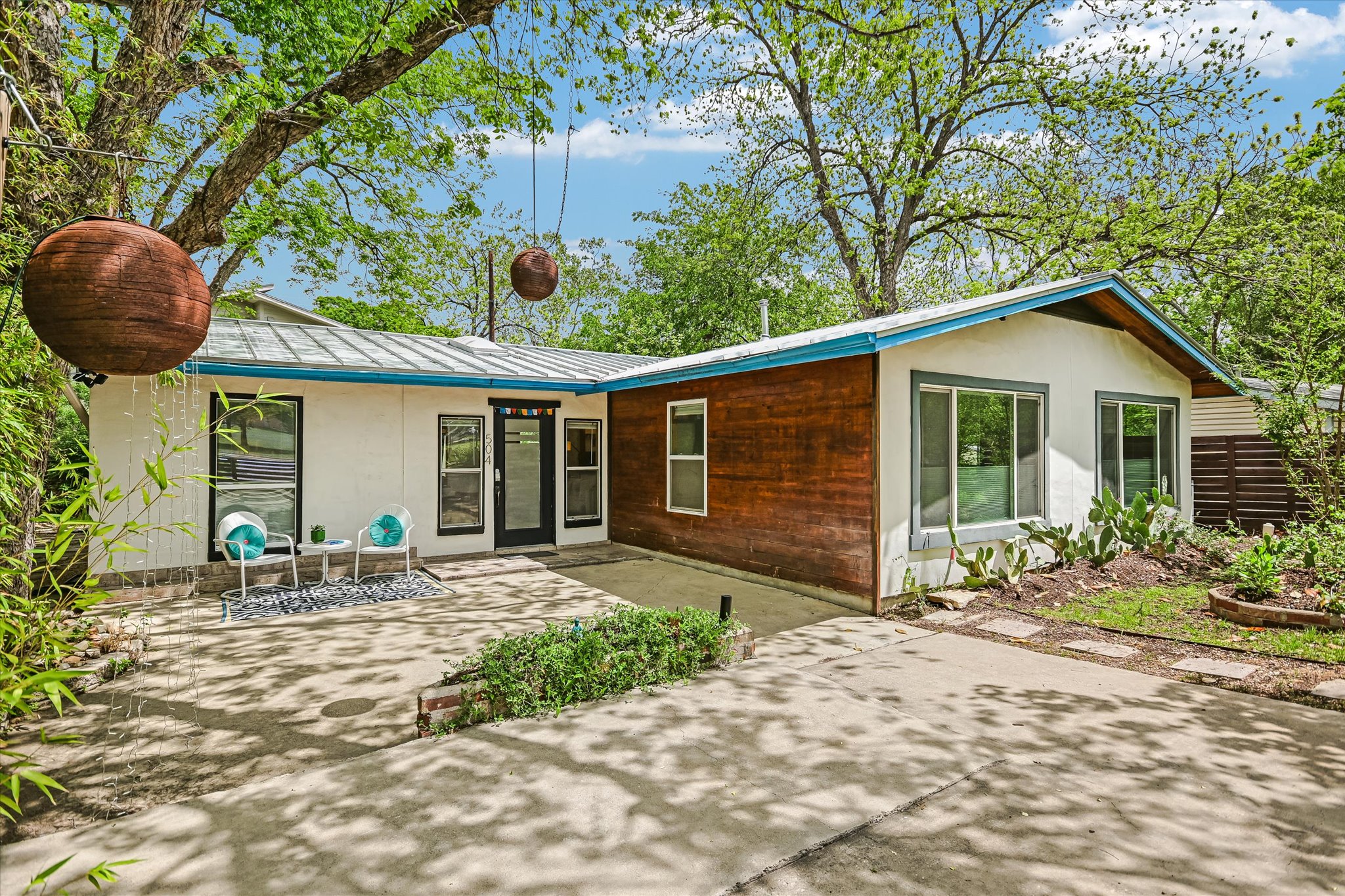 504 Powell Circle Austin, TX 78704 - Photo 23 of 23 a front view of a house with garden and patio