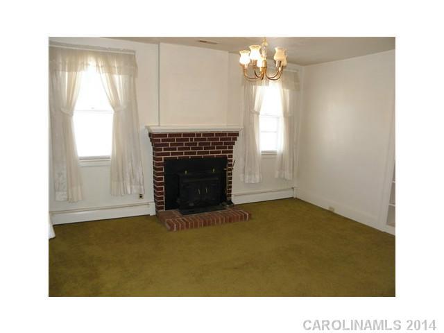 205 26th Street Southwest Hickory, NC 28602 - Photo 4 of 16 a room with windows and fireplace