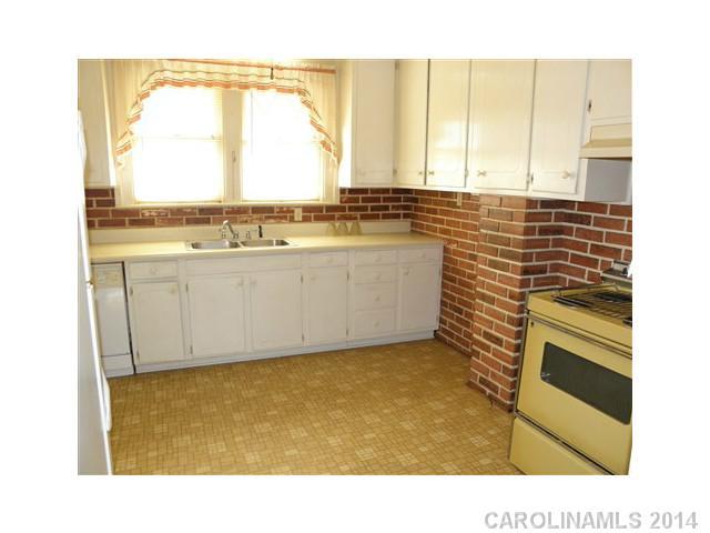 205 26th Street Southwest Hickory, NC 28602 - Photo 5 of 16 a view of kitchen with granite countertop cabinets and outdoor space