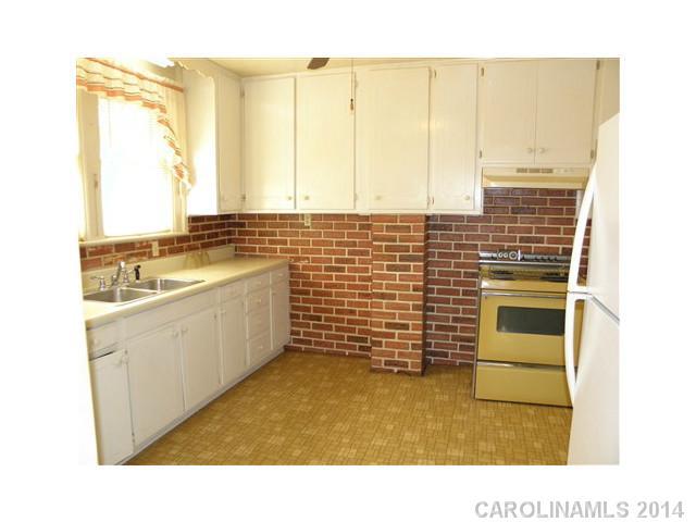 205 26th Street Southwest Hickory, NC 28602 - Photo 6 of 16 a kitchen with appliances cabinets and a sink