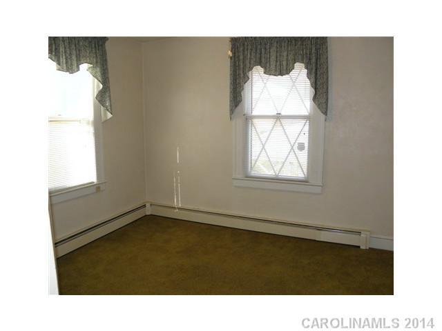 205 26th Street Southwest Hickory, NC 28602 - Photo 8 of 16 a black and white photo of a room