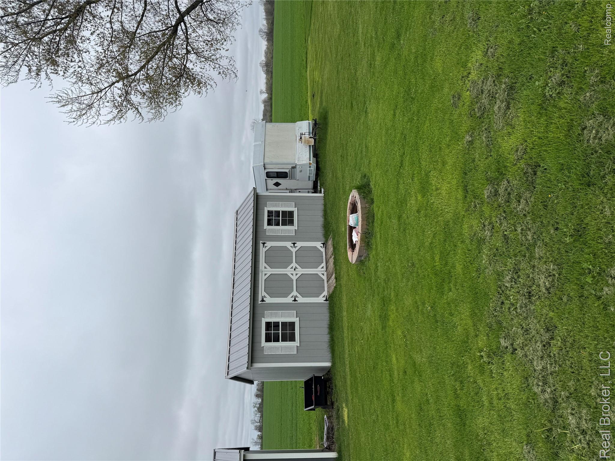 3412 South Reese Road Frankenmuth, MI 48734 - Photo 14 of 17 View of shed featuring an outdoor fire pit