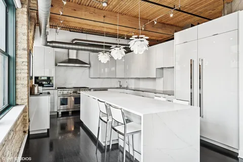 a kitchen with stainless steel appliances granite countertop a stove and a sink