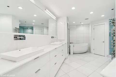 a bathroom with a shower and a bathtub