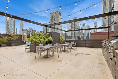 a view of roof with potted plants and bench