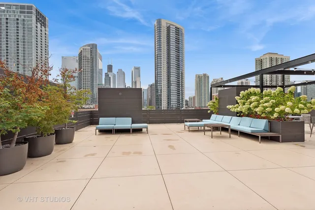 a living room with furniture and floor to ceiling windows