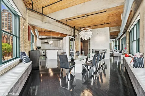 a view of a kitchen with furniture and windows