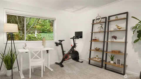 a bathroom with a granite countertop sink a toilet and a large mirror
