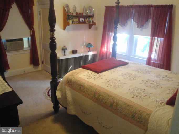 111 South Rolling Road Catonsville, MD 21228 - Photo 1 of 25 a bedroom with a bed and a window