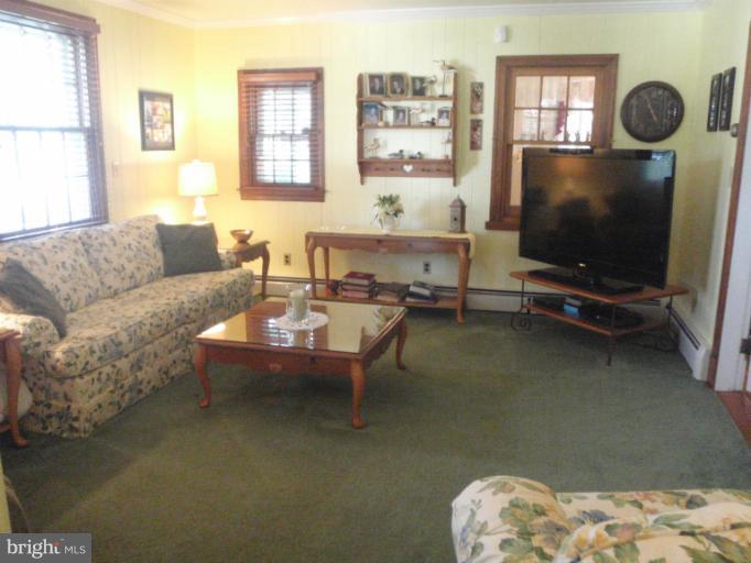 111 South Rolling Road Catonsville, MD 21228 - Photo 11 of 25 a living room with furniture and a flat screen tv