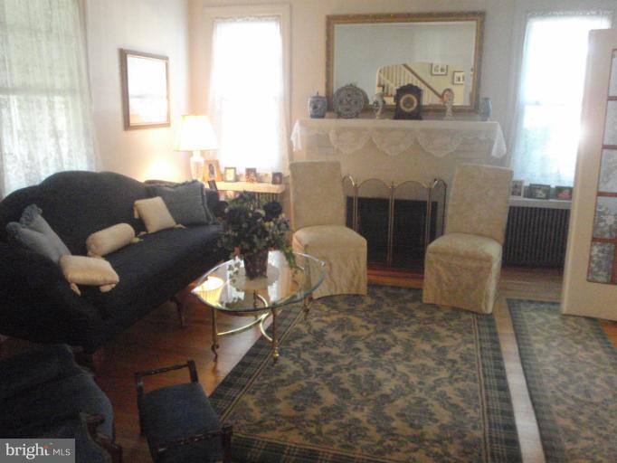 111 South Rolling Road Catonsville, MD 21228 - Photo 24 of 25 a living room with furniture and a fireplace