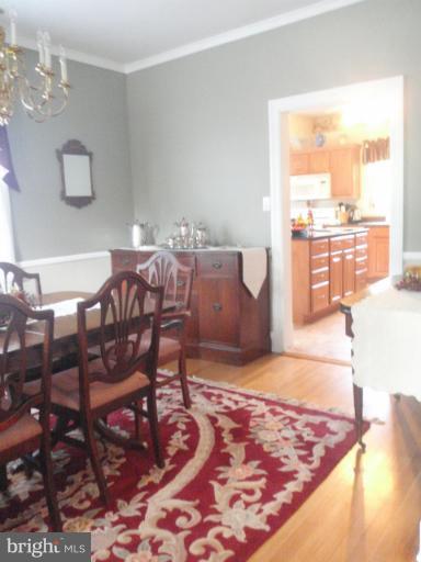 111 South Rolling Road Catonsville, MD 21228 - Photo 4 of 25 a living room with dining room and wooden floor