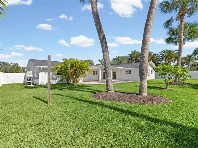 an aerial view of a city with ocean view