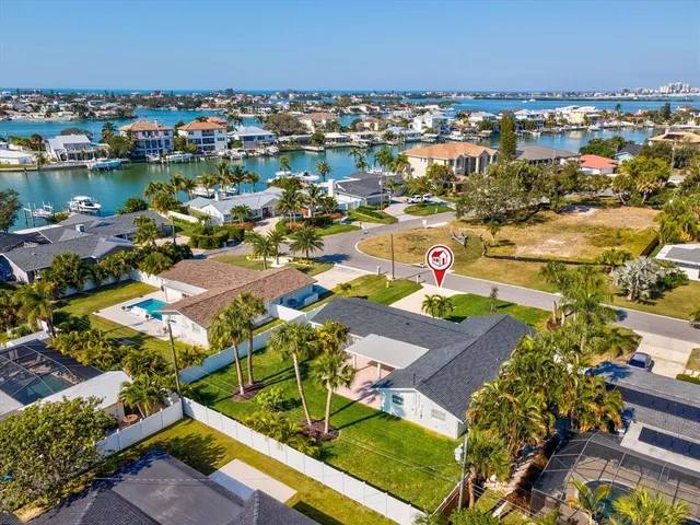 a wooden bench sitting in front of a building