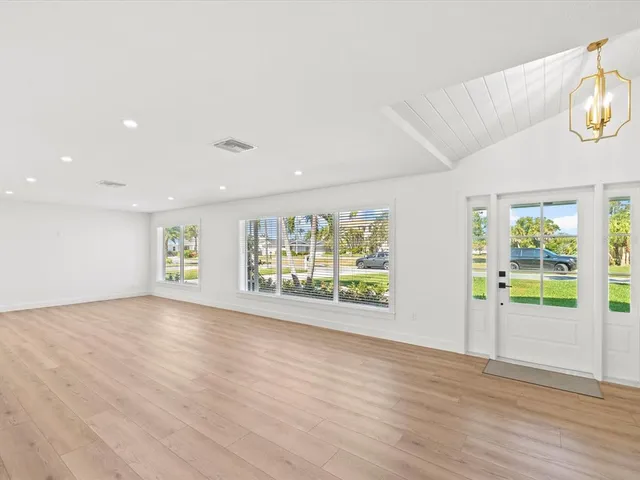 a kitchen with stainless steel appliances a stove top oven and a refrigerator