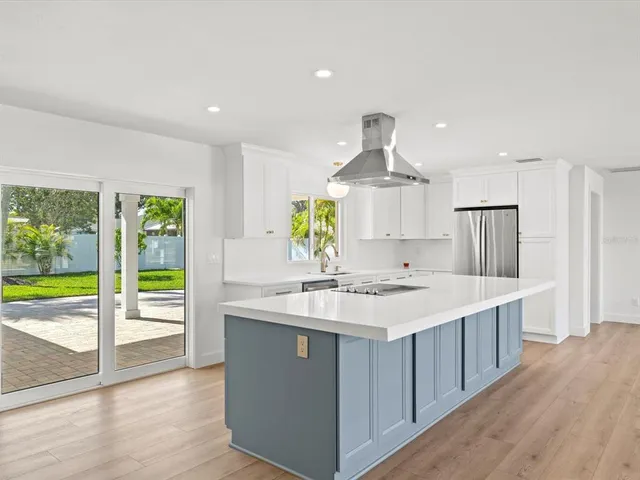 a kitchen with a stove and a kitchen island
