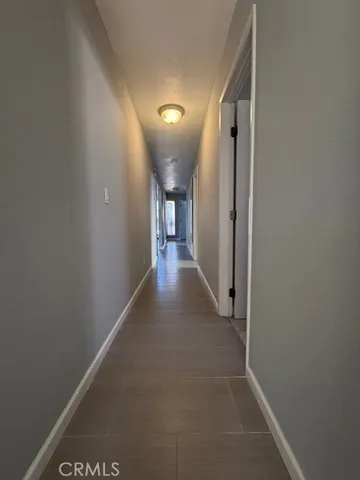 a bathroom with a sink a toilet a mirror and shower