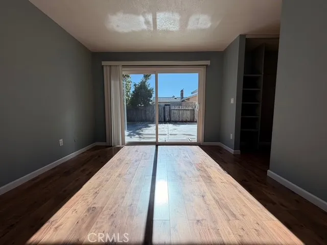 a kitchen with kitchen island granite countertop a sink cabinets and stainless steel appliances