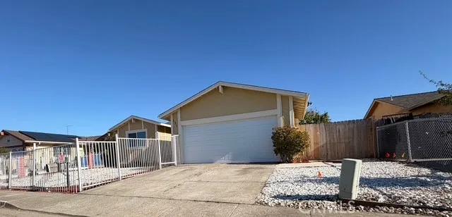 a front view of a house with a garage