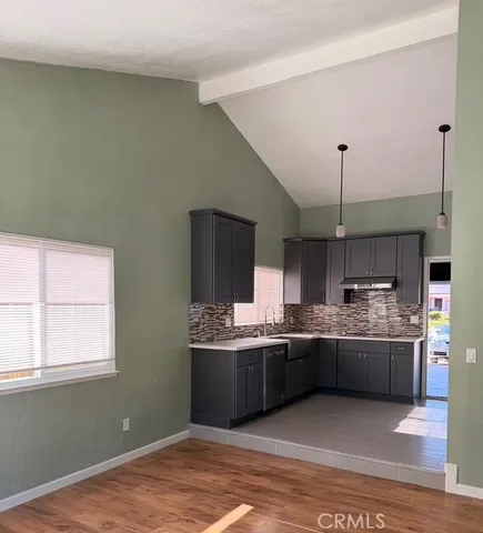 a kitchen with stainless steel appliances a refrigerator and a sink