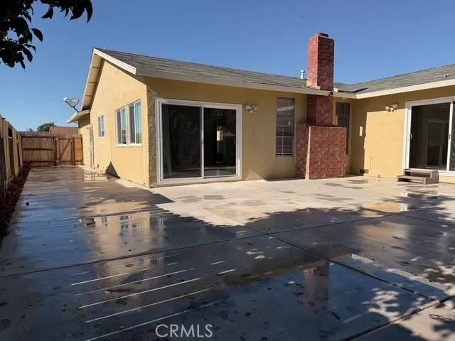 a street view with wooden fence and plants