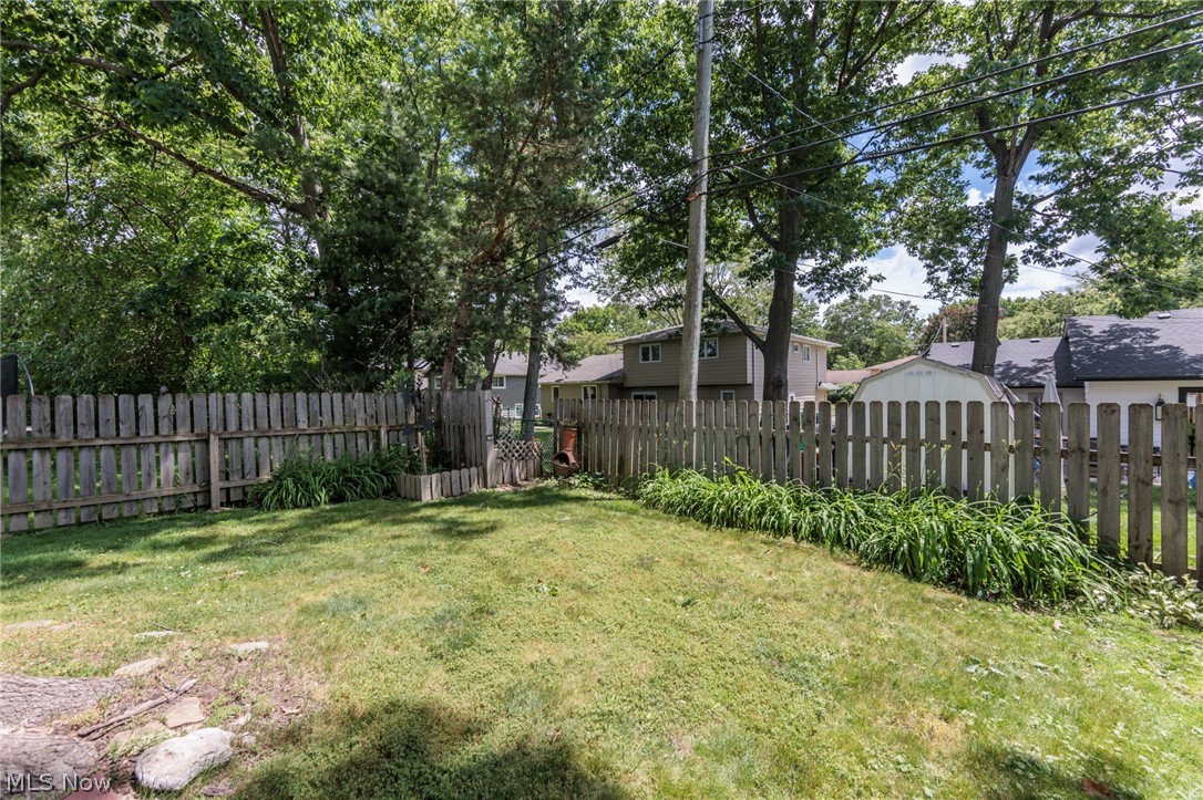 5364 Summit Road Lyndhurst, OH 44124 - Photo 25 of 42 Expansive fenced yard featuring mature trees and established perimeter plantings