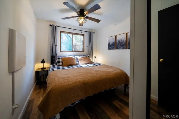 a bedroom with a bed and window