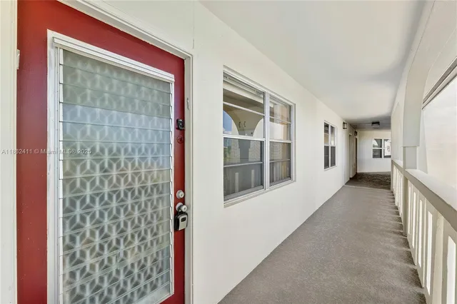 a view of a hallway with windows