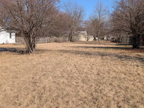 a view of snow on the side of a road