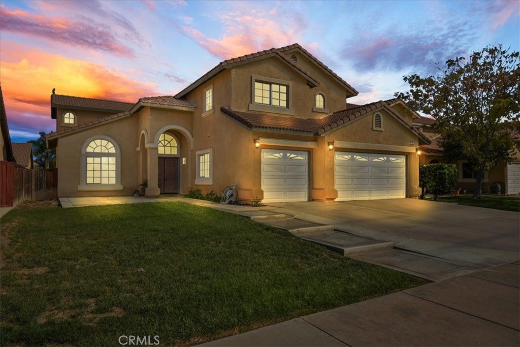 1917 Murrieta Road Perris, CA 92571 - Photo 1 of 1 a front view of a house with a garden