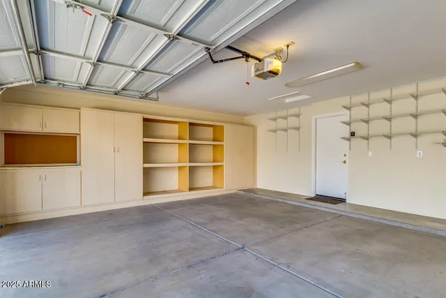 a view of an empty room with a windows