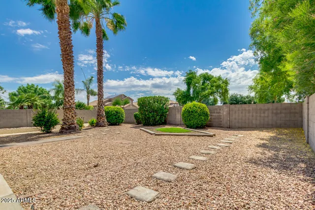 a wooden fence with some trees in the background