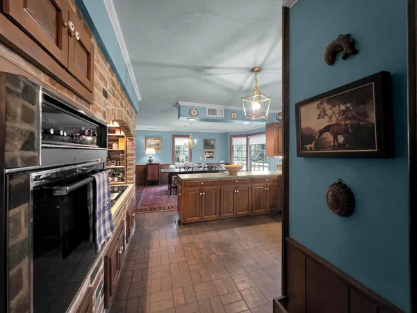 a kitchen with a stove and a refrigerator