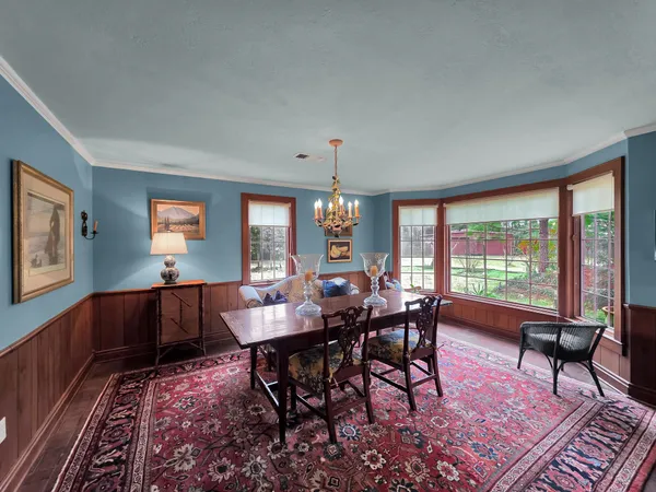 a view of a dining room with furniture window and outside view