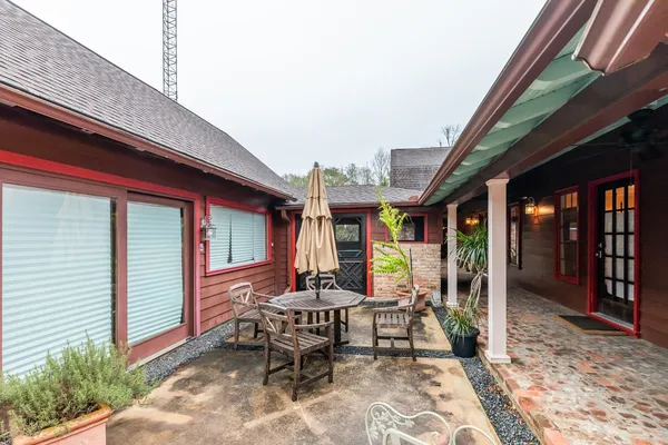 a view of a two chairs in the balcony