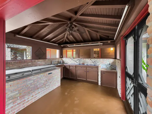 a kitchen with stainless steel appliances granite countertop a stove and a sink with granite countertops